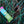 Moonvalley Cardamom energy bar lying in dew-covered grass.