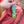 Hand putting an energy bar into a backpack pocket.