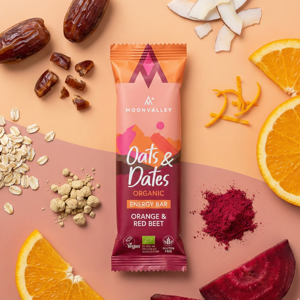 Organic Orange & Red Beet energy bar with sliced oranges, red beet, oats, and dates.