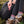 A person sitting with a backpack taking a Moonvalley energy bar out of their side pocket.