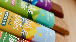 Close-up of Moonvalley organic energy bars in assorted flavours with colourful packaging.