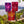 Moonvalley organic sports drink powders in Blackcurrant, Lingonberry and Red Apple flavours displayed in a scenic outdoor setting.