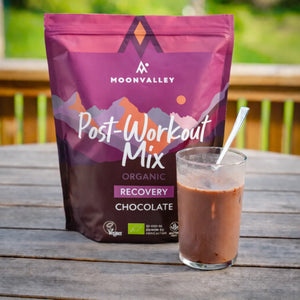 A glass of chocolate Post-Workout drink ready to enjoy outdoors.