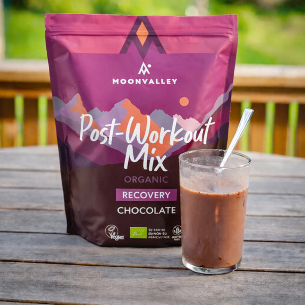 A glass of chocolate Post-Workout drink ready to enjoy outdoors.