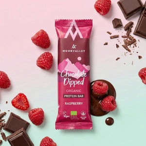 Organic Chocolate-Dipped Raspberry protein bar with fresh raspberries and dark chocolate chunks.