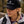 Person wearing a Moonvalley cap during an outdoor hiking adventure.