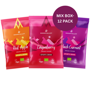 Three sachets of Moonvalley organic sports drink (Red Apple, Lingonberry, Blackcurrant) labeled 