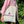 Person carrying a Moonvalley cotton tote bag with a purple logo.