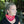 Woman wearing a red Moonvalley Mountain Tube around her neck.